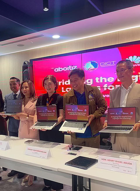 FROM left: Go Digital PH executive director Mishy Co, Aboitiz Foundation president Ginggay Hontiveros-Malvar, DICT Secretary Henry Rhoel Aguda and Huawei Philippines lead the ceremonial turnover of 100 laptops under the ‘Laptops for Learning’ initiative at Ayala Triangle Gardens on Tuesday.