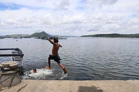 Kids take a dip at Taal Lake Fish Port in Laurel, Batangas. The town made headlines as the Philippine Coast Guard started the search for the remains of the ‘missing sabungeros.’