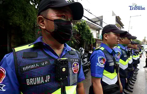 Members of the Swift Traffic Action Group (STAG) clear illegally parked vehicles in Quezon City Policy.