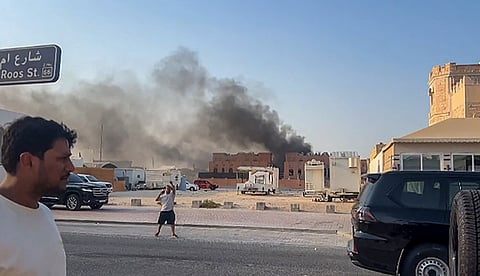 Smoke billows after explosions in Qatar’s capital Doha on Wednesday.