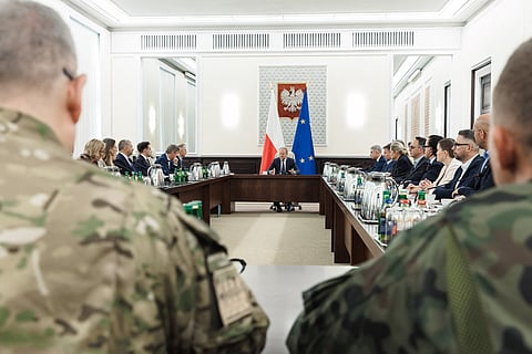 This September 10, 2025 hand out image released by the Polish Prime Ministers office shows Poland's Prime Minister Donald Tusk (C) leading an emergency meeting in Warsaw after Russian drones violated Polish airspace. NATO air defences helped counter drones that entered Polish airspace overnight and alliance chief Mark Rutte is in contact with Warsaw, a NATO spokeswoman said. Polish Prime Minister Donald Tusk said that a violation of Polish airspace by several Russian drones overnight was a major provocation aimed at the EU and NATO member.