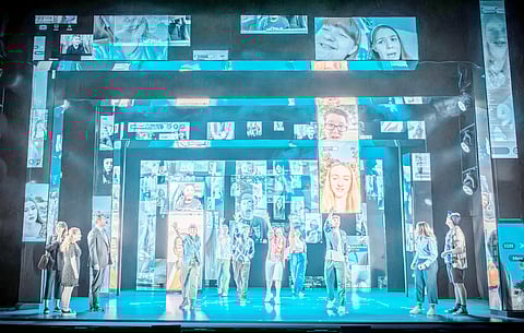 The clever use of mirrored sliding panels and a glasshouse motif — easily assembled for a touring production — amplifies the emotional impact.