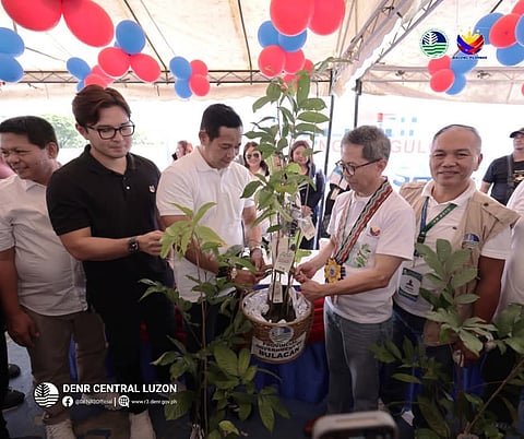 SECRETARY Raphael Lotilla leads the turnover of 2,410 bamboo propagules and fruit-bearing tree seedlings to the Bulacan provincial government during the Handog ng Pangulo celebration at the Bulacan Sports Complex in Malolos on 13 September 2025.