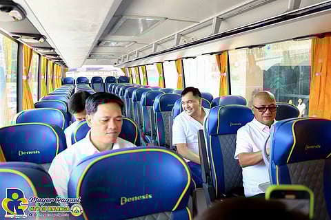 BOARD members Popoy del Rosario and Victor Baluyot, together with Balanga City Vice Mayor Francis Garcia, board the Genesis bus.