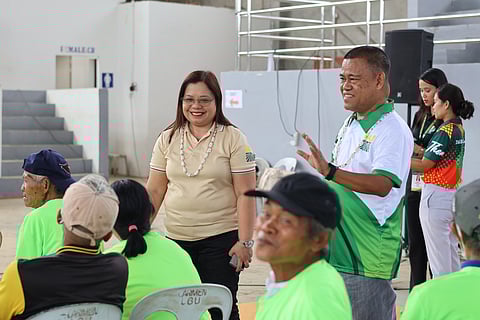 DAR Regional Director Sheila B. Enciso and DAR Provincial Agrarian Reform Program Officer Ronald I. Pumatong with ARBs.