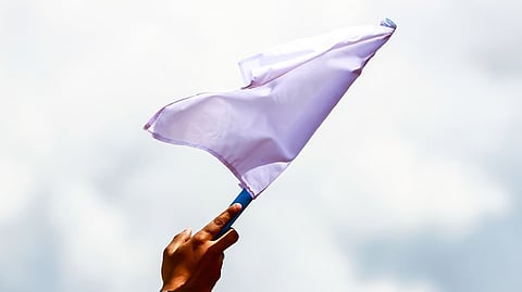 Former insurgents wave white flag