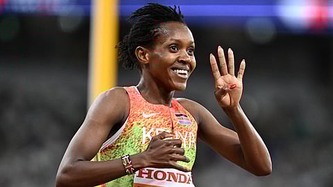 FAITH Kipyegon flashes the ‘four’ sign after winning her fourth gold medal in the 1500-meter run of the World Athletics Championships in Tokyo, Japan.