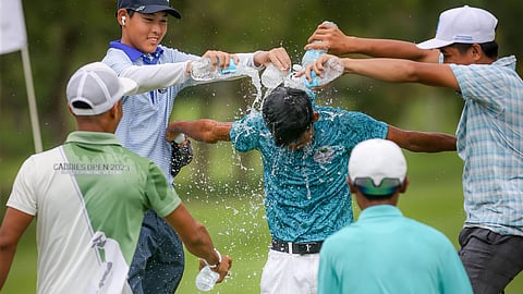 JOHN Paul Oro is doused with water by fellow competitors after winning the ICTSI Negros Occidental Junior PGT Championship at Marapara course.