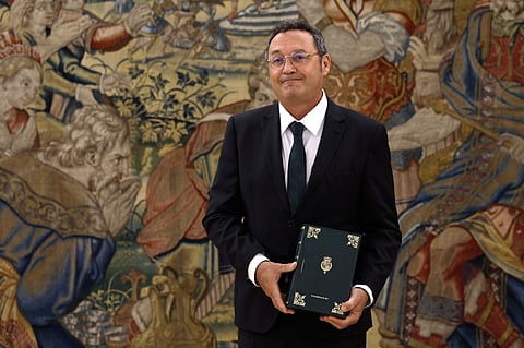 (FILES) Spain's Attonery General Alvaro Garcia Ortiz holds the Annual Report of the Attorney General’s Office prior to presenting it to the king on September 3, 2025 at La Zarzuela Palace in Madrid. The Spanish Supreme Court imposed a €150,000 bail on Attorney General Alvaro Garcia Ortiz September 9, 2025 and formally confirmed that he will stand trial for alleged violation of judicial secrecy, in an awkward case for the government of Socialist Pedro Sánchez, who appointed him.