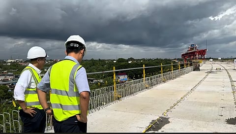 Acting Transportation Secretary Giovanni Lopez (left) and a Japanese engineer inspected a portion of the North-South Commuter Railway project in Cabuyao, Laguna.
