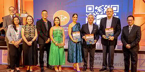 Evelyn Leiva (sixth from left), OPC chief CSR and sustainability officer and Juan Carlos Corujo (seventh from left), lead the launch of the company’s first ever sustainability report.
