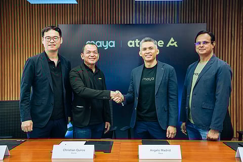 ATOME Philippines country general manager Chris Quiros (second from left) shakes hands with Maya Bank president Angelo Madrid (third from left) to mark a P2.75-billion loan channeling partnership in Manila, joined by Atome Financial CEO Jefferson Chen (left) and Maya Bank COO Manu Panda (right).