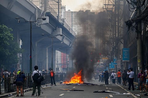 CRACKDOWN. PNP personnel arrest violent protesters at Mendiola, Manila, on the afternoon of 21 September 2025.