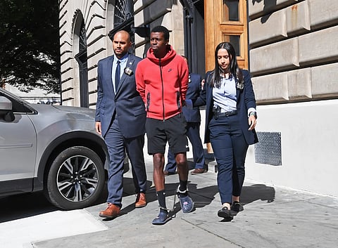 30 year old Bronx man Xavier Chapman walks with his lawyers after being arrested in connection with the assault of a 19-year old