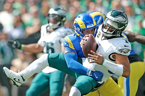 JALEN Hurts gets tackled during the Philadelphia Eagles’ 33-26 victory over the Los Angeles Lakers in the National Football League.