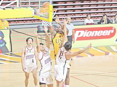 MARK Belmonte, Jacob Bayla and the UP Fighting Maroons struggle to contain Collins Akowe and the UST Growling Tigers in their opening game in Season 88 UAAP men’s basketball tournament last Sunday.