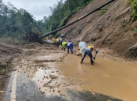 Personnel of different government agencies and department s, Barangay local government units and community volunteers clean up the roads and areas of fallen trees, muds, rocks and other debris on September 23, 2025 as typhoon "Nando" exited the country's area of responsibility. | Aldwin Quitasol. Photos Courtesy of BFP Mountain Province, LGU Barlig, Mountain Province DRRMO.