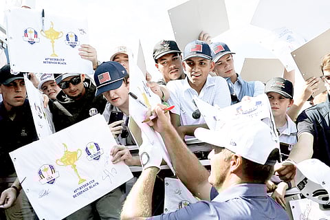 Bryson DeChambeau of Team United States signs autographs for fans prior to the Ryder Cup 2025 at Black Course at Bethpage State Park Golf Course on Tuesday in Farmingdale, New York.