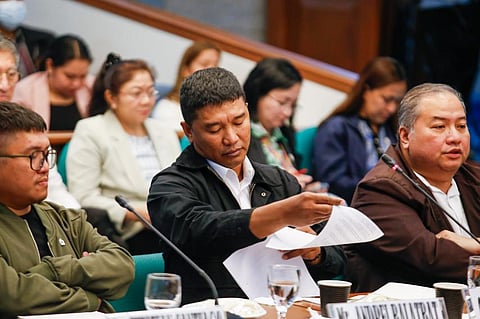 Orly Regala Guteza (left), a former security consultant of Ako Bicol party list representative Zaldy Co, confirms delivery of "basura" to the respective residences of former House speaker Ferdinand Romualdez and representative Co at the Senate Blue Ribbon Committee hearing on 25 September 2025. "Basura" is a term Regala and his team used referring to luggage containing dirty money. (Toto Lozano)