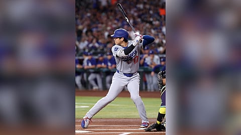 SHOHEI Ohtani belts a home run to lift the Los Angeles Dodgers to an 8-0 win over the Arizona Diamonds for the National League West title.