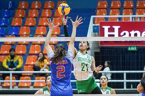 ZAMANTHA Nolasco of College of Saint Benilde tries to score on a dink off the defense of Sam Tiratira of Arellano during the 2025 V-League Collegiate Challenge preliminaries on Monday. The Lady Blazers won, 25-15, 21-25, 25-21, 25-16.