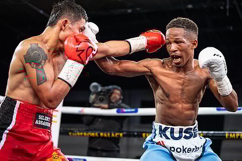 Siyakholwa Kuse (right) fires his way to a unanimous decision win over Filipino Samuel Salva in their duel last May.