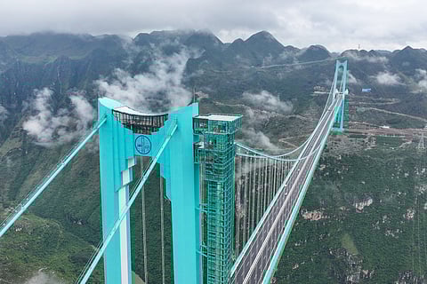 The Huajiang Grand Canyon Bridge, the world’s highest, is seen in China’s southwest Guizhou province on September 27, 2025. The world's highest bridge opened to traffic in China on September 28, state media said, capping an engineering feat three years in the making and snatching the record from another bridge in the same province.