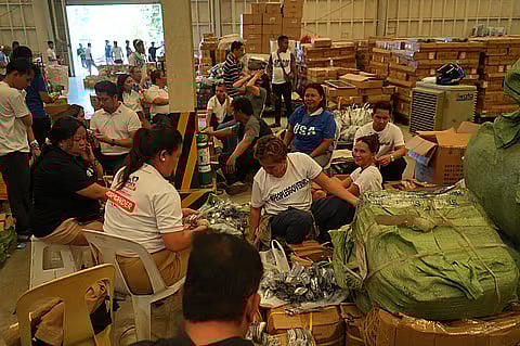 Food packs are being arranged by volunteers in Cebu that would be distributed to earthquake victims in the said province.