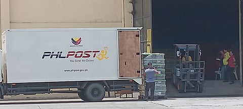 Postal trucks join quake relief