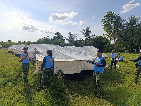 IN a powerful display of unity and compassion, the Philippine National Police, Philippine Red Cross and Department of Public Works and Highways have started setting up tents in Barangay Cogon, Bogo City, Cebu. These temporary shelters provide safe refuge for families whose homes were damaged by the recent earthquake, offering comfort and security as they begin their recovery.