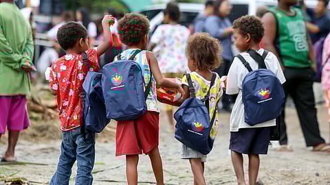 Ready for future Aeta children carry their free school supplies following their distribution during President Ferdinand Marcos Jr.’s visit to Pampanga. Their parents received cash, carabaos and farm equipment.