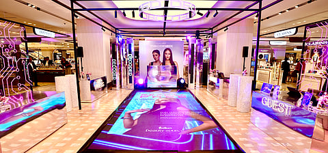 The space comes alive with striking design elements that echo the campaign’s central theme.