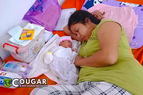 During the wake of Severe Tropical Storm Paolo, soldiers of the Philippine Army helped deliver a baby in Palauig, Zambales.