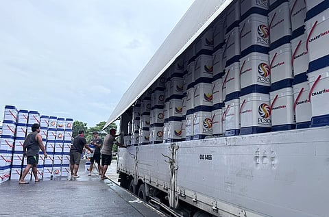 Workers and officials from the Philippine Charity Sweepstakes Office, Light Rail Authority, Metropolitan Manila Development Authority and volunteers from various groups load hundreds of PCSO’s 'Charitimba' at the LRTA headquarters. They donations are set to be delivered to Cebu and Masbate.