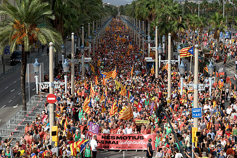 Participants take part in the "Diada" pro-independence march on the national day of Catalonia in Barcelona, on September 11, 2025.