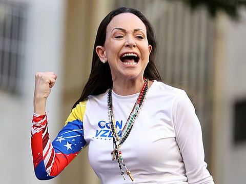 Venezuelan opposition leader Maria Corina Machado gestures supporters during a protest called by the opposition on the eve of the presidential inauguration, in Caracas on January 9, 2025.