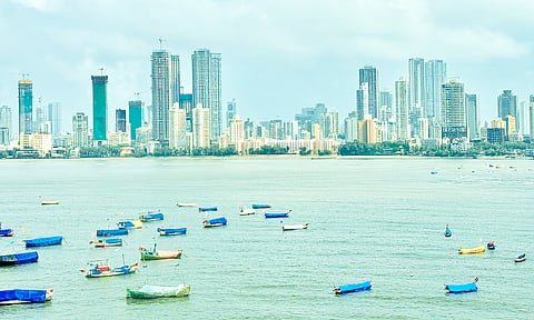 From Mumbai’s longest bridge, dozens of small boats punctuate the Arabian Sea, ferrying fishermen, goods, commuters along the city’s busy coastline.