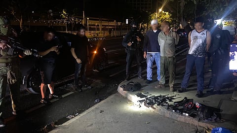 Police operatives present the confiscated firearms and ammunition following an entrapment operation along Roxas Avenue, Davao City, in the early hours of October 13, 2025. A police officer assigned to RMFB14 and a civilian were arrested for alleged involvement in illegal firearm trading. The seized items included high-powered rifles, pistols, ammunition, and boodle money used during the operation.