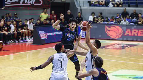 BONG Quinto of Meralco loses the ball against the tight Blackwater defense during their PBA 50th Season Philippine Cup on Wednesday. The Bolts won, 105-96.