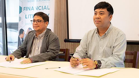 Marju Geslani, CEO of CertifyPro (left), and Krishna Alejandrino, Executive Director of JA Philippines (right), during the signing of the partnership agreement at the JA CertifyPro Event.