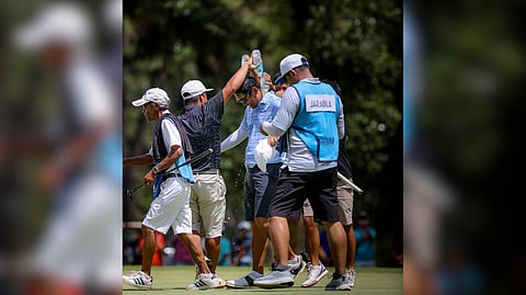 REYMON Jaraula gets a celebratory splash from fellow players after clinching the ICTSI Del Monte Championship at Del Monte Golf Club on Friday.