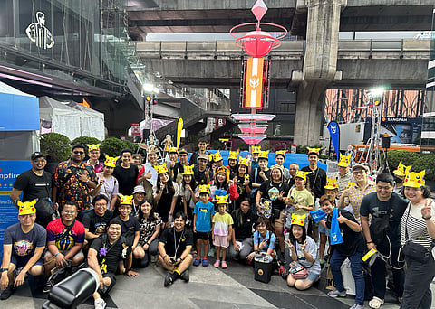Pokemon Go Trainers from around the world gather for a commemorative photo.