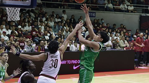 Luis Pablo soars for a hook shot over UP’s Miguel Yniguez during La Salle’s 72-69 victory to end the first round of the UAAP Season 88 men’s basketball tournament.