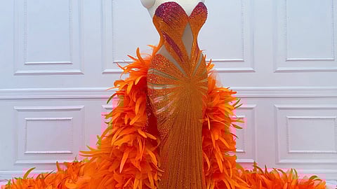 The now iconic Orange Gown worn by 2025 Miss Grand International Emma Tiglao designed amd created by Rian Fernandez