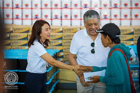 Special Assistant to the President (SAP) Antonio Ernesto “Anton” Floirendo Lagdameo, Jr. (right) and Department of Tourism (DOT) Secretary Christina Garcia Frasco (left) on Monday (Oct. 20) during the distribution of Emergency Cash Transfer (ECT) assistance to 677 tourism workers affected by Typhoon Opong in Masbate City.