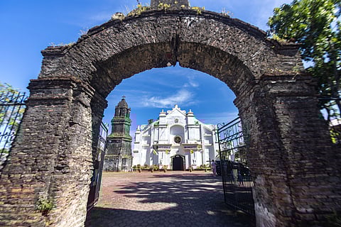The majestic Basilica Minore of St. John the Baptist in Badoc, Ilocos Norte, stands proudly under the blue Ilocano sky — a symbol of faith, art, and transformation. Once a town marked by fear, Badoc now shines as a sanctuary of hope and heritage. It is here that Filipino painter and national hero Juan Luna was baptized, forever linking this sacred place to the soul of Philippine history.