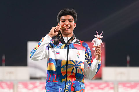 PI Durden Wangkay celebrates after lucking the Philippines’ third gold medal in the 200-meter run of the 3rd Asian Youth Games in Bahrain late Saturday.