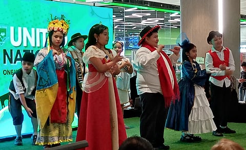 GRADES 1 and 2 students of Marymount Academy wearing national dresses of Asian and South American countries perform at the UN Parade of Nations at the SM City BF Parañaque on 24 October. Six-year-old June Chandler Palmes (top, right), one of two winners of best costume with his South Africa outfit.