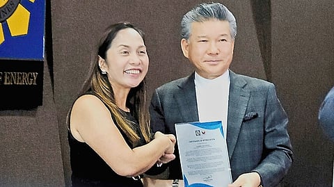 Energy Secretary Sharon Garin hands Asia Economic Development Committee of South Korea chairperson Yoon Sukhun a plaque of appreciation after a knowledge-sharing meeting on the use of clean energy, including nuclear power.