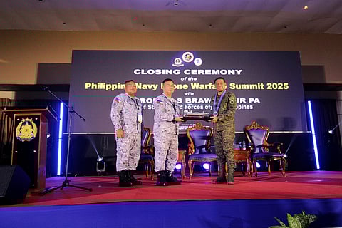Armed Forces of the Philippines (AFP) Chief of Staff General Romeo S. Brawner Jr. PA receives a scale model of a sea drone from PF Commander Rear Admiral Joe Anthony C. Orbe PN during the closing ceremony of the Drone Warfare Summit 2025 held at the Subic Bay Exhibition and Convention Center (SBECC) in Subic Bay Freeport on 29 October 2025.